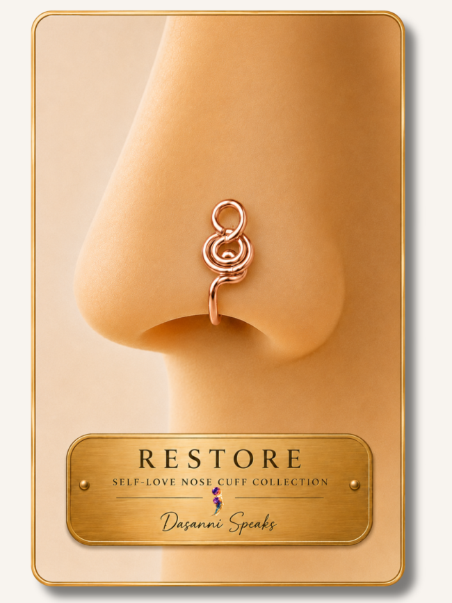 Close-up of the Restore handcrafted rose gold wire wrapped nose cuff worn on a model from the Dasanni Speaks Self-Love Collection.